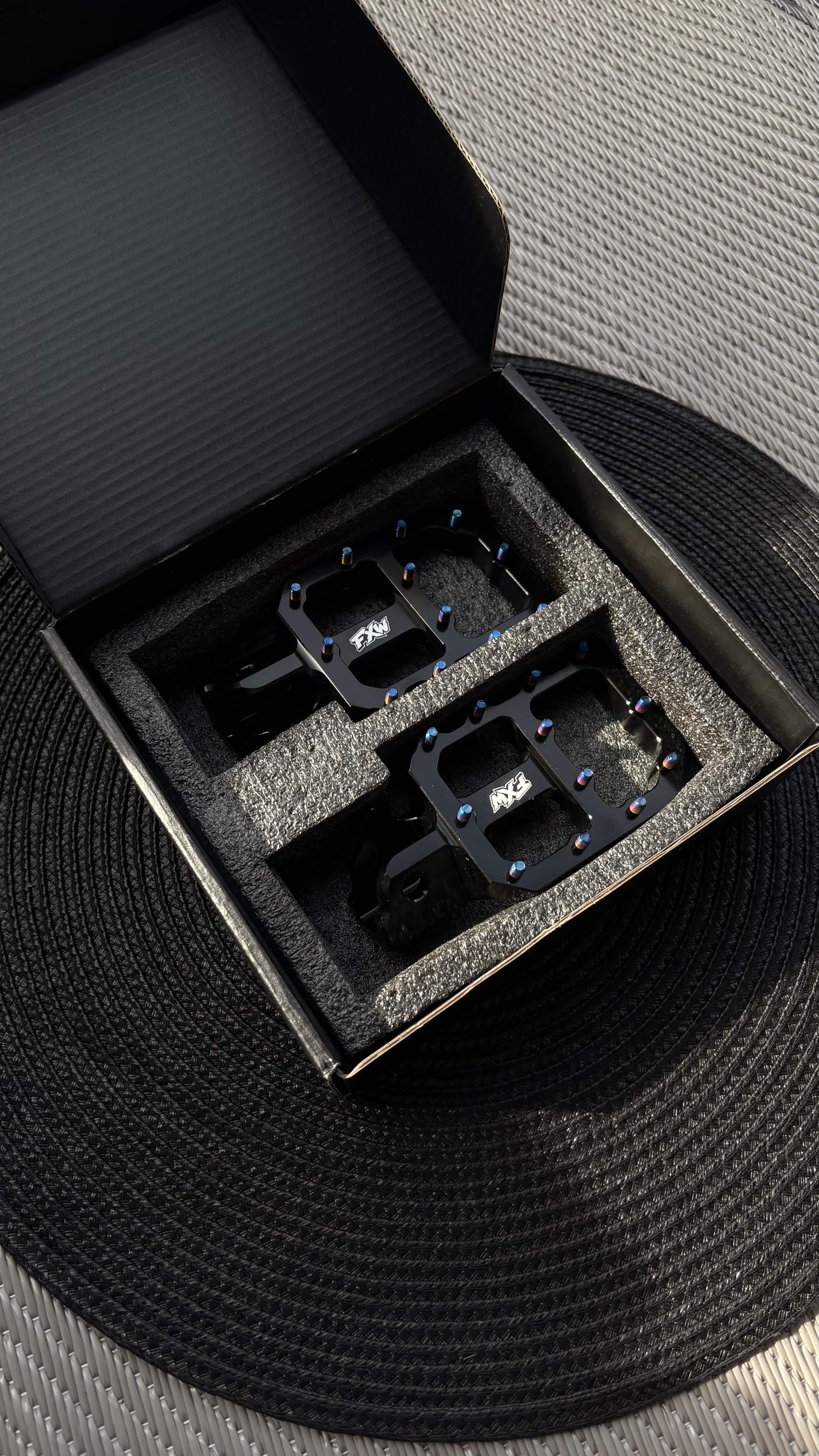 FxW Wide Footpegs with Titanium Bolts Black/Silver - Fits On Most Bikes